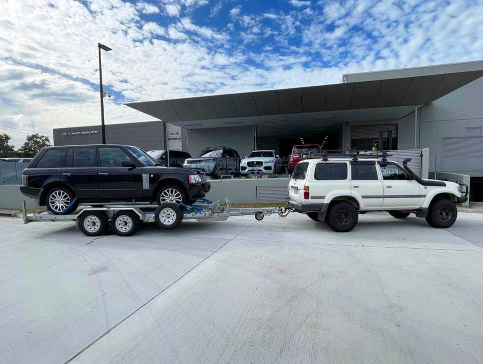 Car trailer carrying an SUV